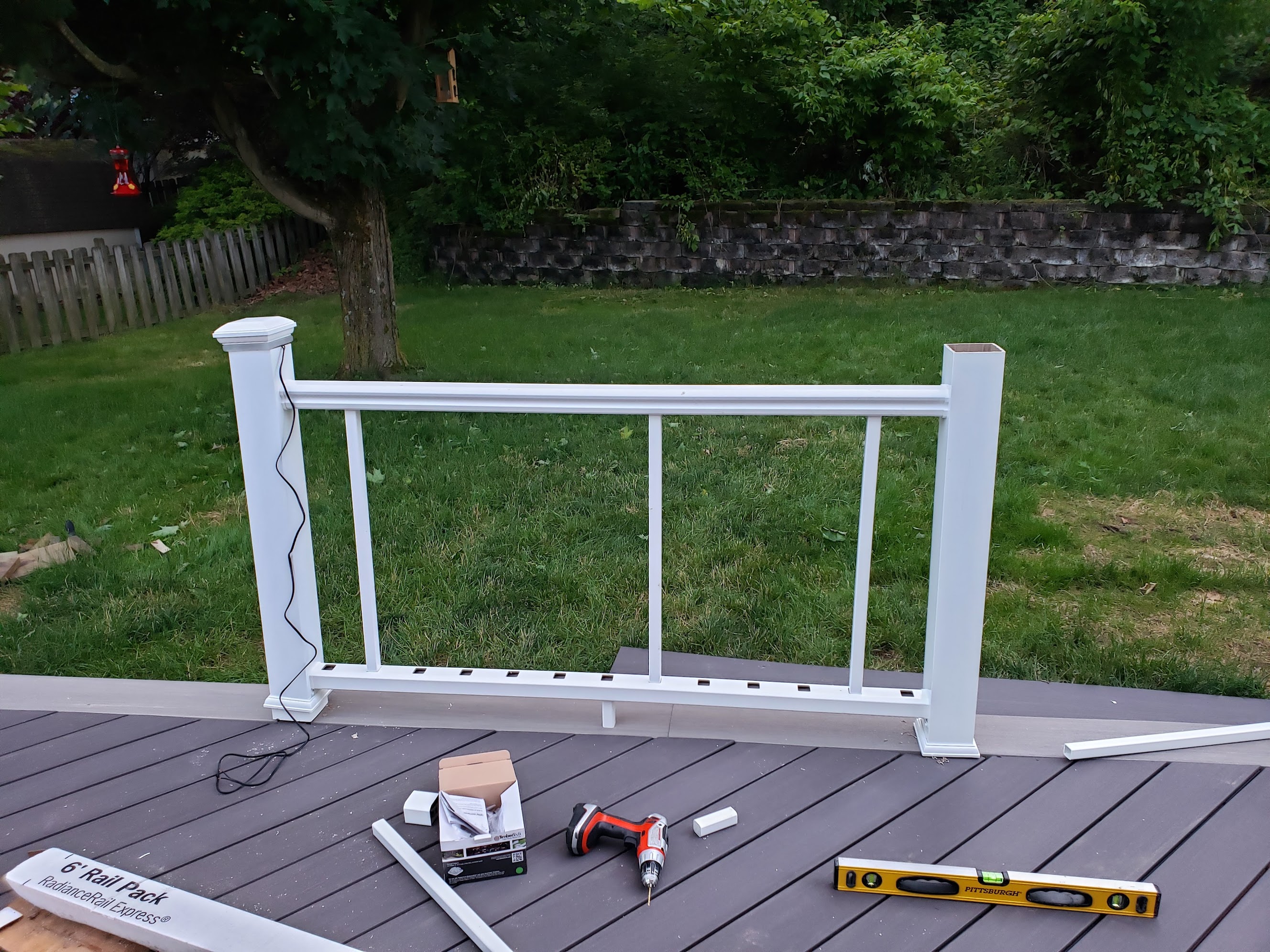 Wire being routed through railing post during installation