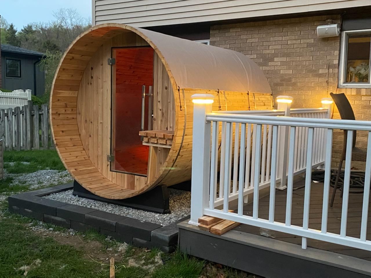 Deck railing post lights glowing at dusk