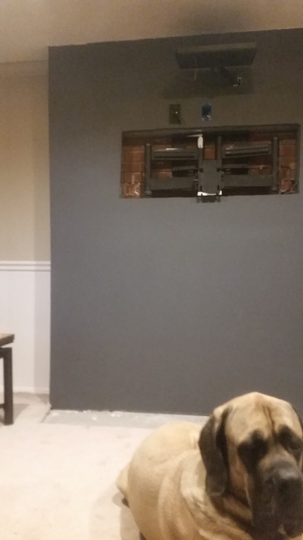 Painted wall with Bane in foreground