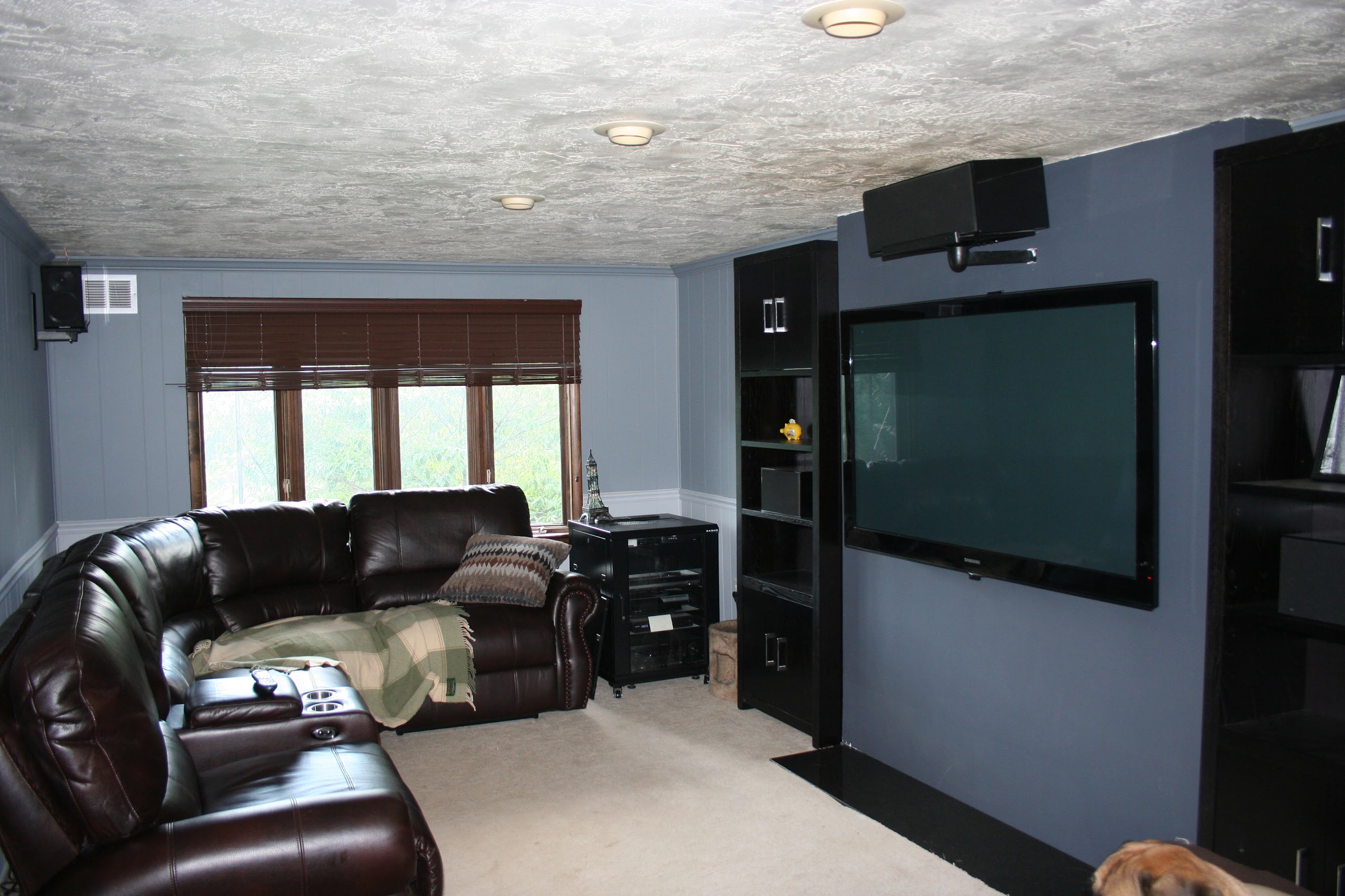 Full room shot, speaker on top of TV