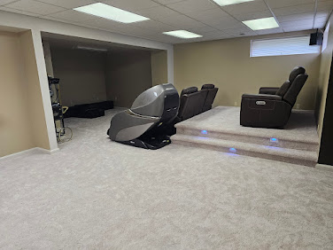 Carpeted platform with LED step lights and seating