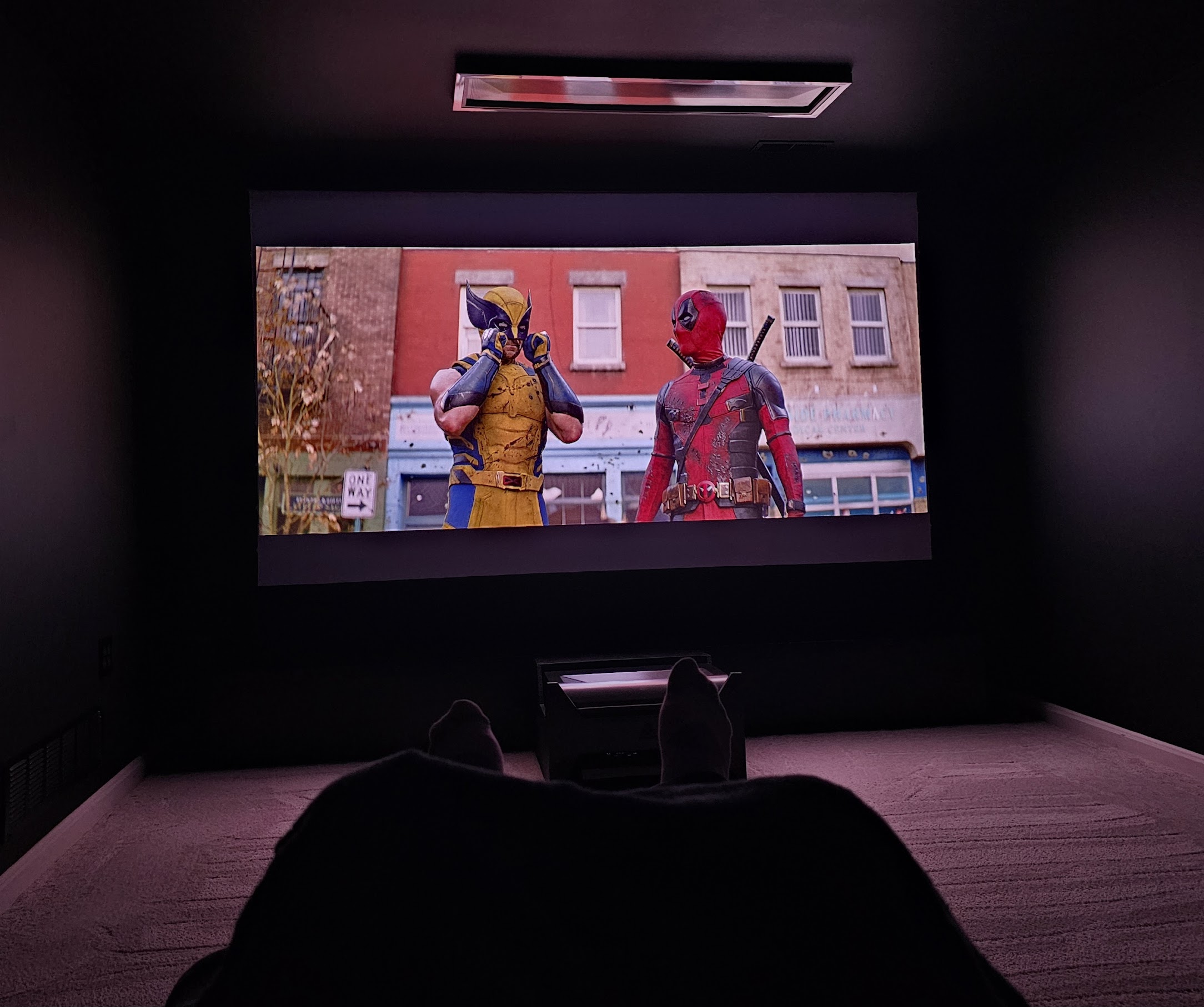 120 inch projected screen showing Deadpool and Wolverine